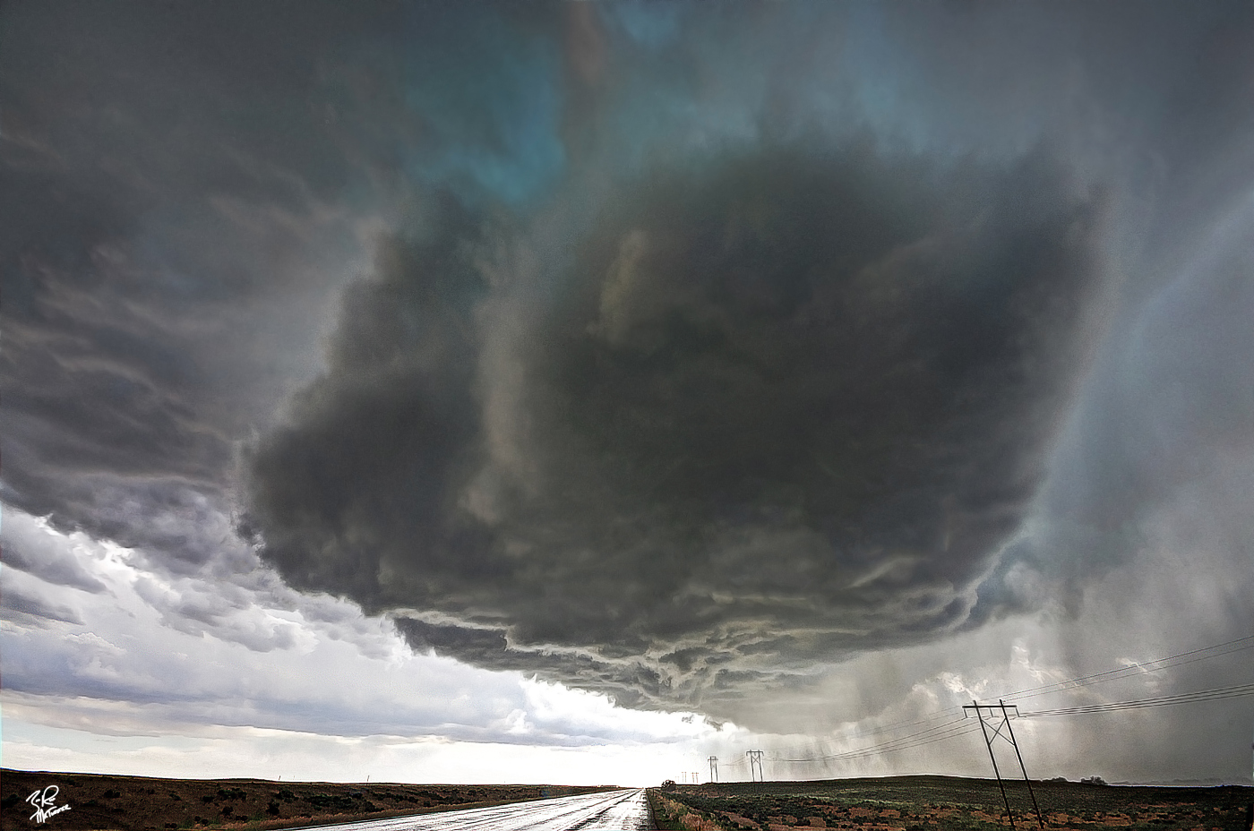 Crazy chase day in NE Colorado this past June. I watched this wall cloud with decent rotation pass directly over me near Brush. The storm was tornado warned for some time..then came the hail. Over a foot pea to marble size hail covered everything around me.