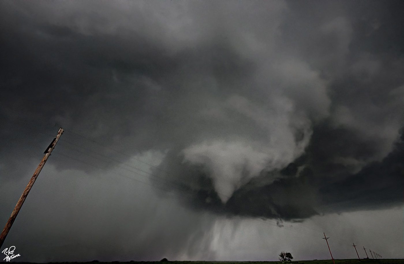 Ominous as it may be, the dance that a wall cloud performs just before producing a tornado is mesmerizing. The dynamics that come into play at that very moment are so incredible we still don't fully understand how they work. This brief tornado spun directly in front of us near Wellington Kansas this past May.