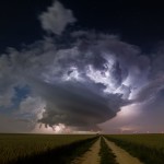 Lonesome french supercell with intense intracloud lightning beneath a starry sky on a moonlit night near Rethel, Champagne-Ardennes, France, June 8th 2014