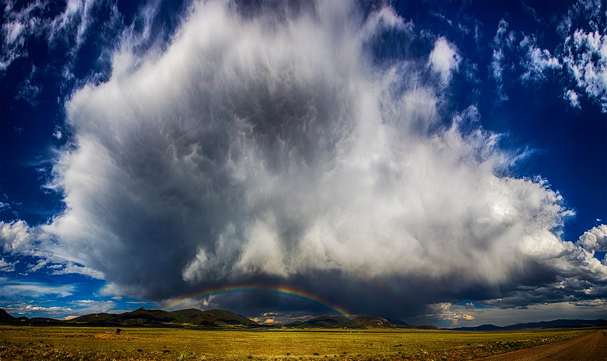 It is hard to see in this shot but there were 4 rainbows under this thunderhead over Wilkerson Pass, CO earlier this month.