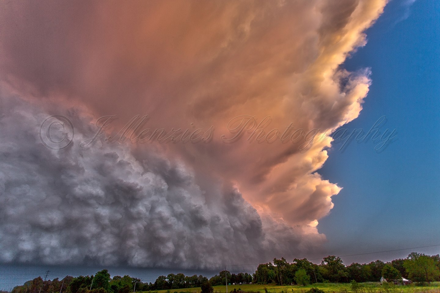 Taken April 27th 2014. This was a day i wont forget in a hurry. I planned on chasing the High risk in Arkansas this day, but as i didn't know the area very well or have a navigator, i decided to head back into Oklahoma. I was driving back NW towards I-35 from SE Oklahoma when some towering cumulus went up ahead of the dryline. 30 minutes later i was sitting on the west side of a huge squall line with sunset approaching. Ive been waiting years for a shot like this. I took close to 200 photographs during the sunset to get the right color. I was thrilled with the outcome. The only thing i regret is not doing a timelapse.