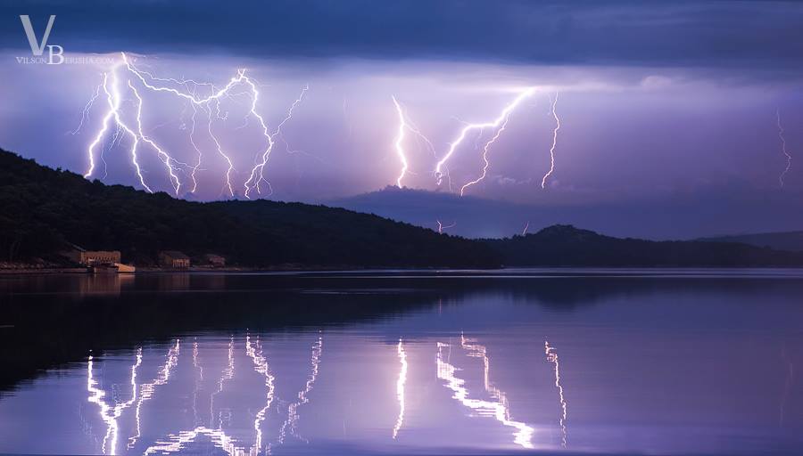 Morning storm, with spectacular lightning along the calm sea...makes awesome mirror effect 10/09/2014 Island Losinj Croatia Morning storm, with spectacular lightning along the calm sea...makes awesome mirror effect 10/09/2014 Island Losinj Croatia